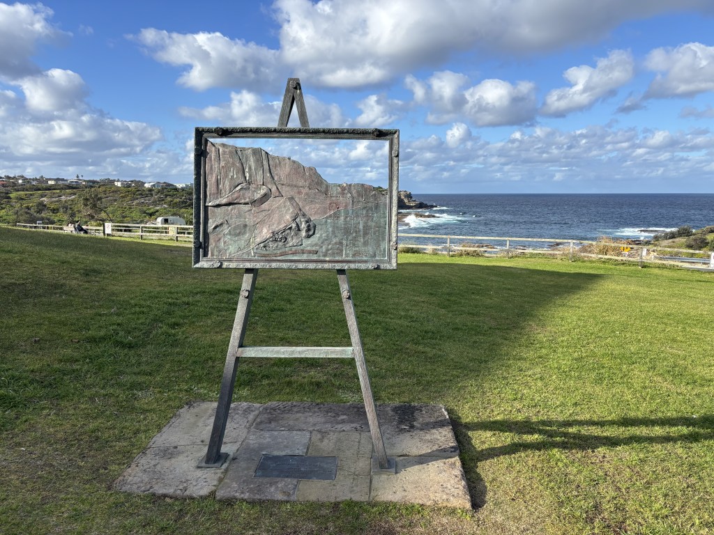 “Christo the Artist” monument by Eileen Slarke at Little Bay memorialising the 1969 wrapping of the cliffs of the bay by Christo and Jeanne-Claude